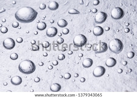 Close up Water droplets on aluminum paper. Splash water droplets on metallic.