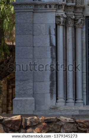elements of architectural decorations of buildings, columns, arches, capital and patterns, on the streets in Catalonia, public places.