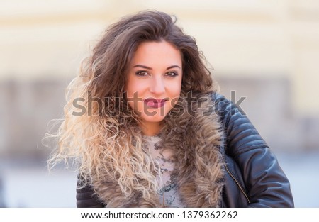 Closeup portrait of a beautiful woman in the street