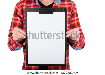 A man holding plastic clipboard with a white booklet