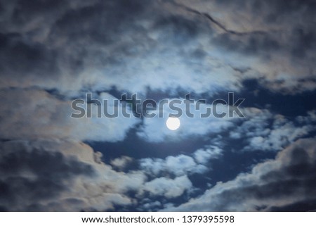 Moon with clouds in the night sky