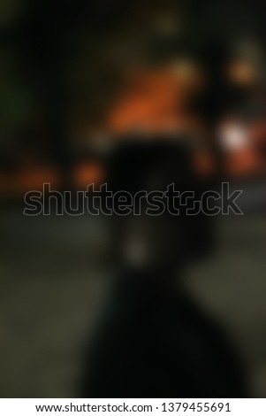 Blurred silhouette of the girl on the background of the night city 2