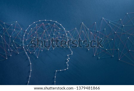 Information flux concept. Network of pins and threads in the shape of a stream of information going through a brain symbolising the hyper connected mind of the digital era. Royalty-Free Stock Photo #1379481866