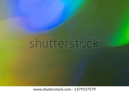 Green bokeh spots. Faded yellow background. Colorful lens flare wallpaper.