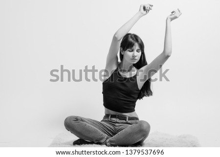 Relaxed lady. Carefree facial expression. Black and white full length portrait of emotional girl. Meditation session.