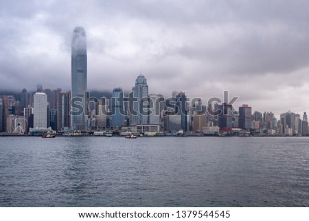 Beautiful panorama view of hong kong city and river on overcast and clouds sky background