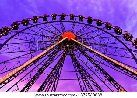 Ferris wheel night. Ferris wheel carnival illuminated colorful lights. Odessa, Ukraine.