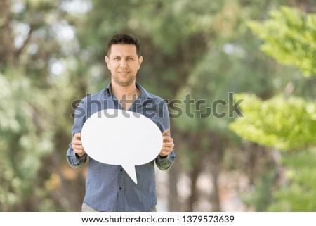 Man holding speech bubble