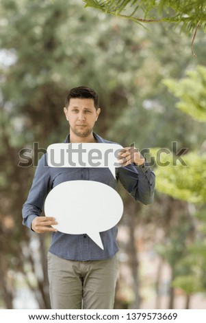 Man holding speech bubble