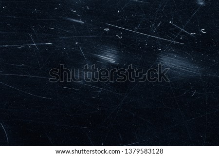 Dust and scratches on black surface. Abstract background. Texture layer for photo editor. Old grunge filter effect.