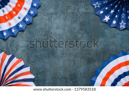 Paper fans USA flag colors on grunge background.