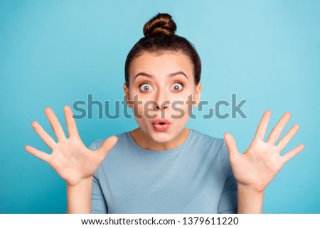 Close up photo beautiful she her lady arms hands raised frightening picture after watch horror film movie peekaboo player scared amazed wear casual sweater pullover isolated blue bright background