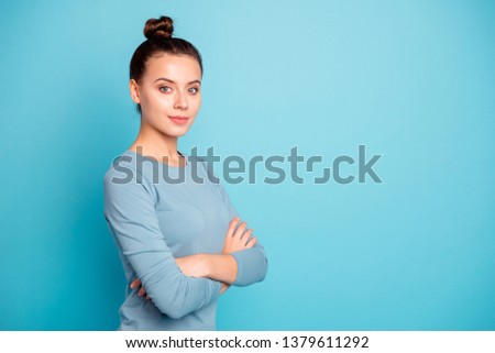 Close up side profile photo cute beautiful amazing she her lady arms crossed stylish hairstyle look wondered self-confident clever smart wear casual sweater pullover isolated blue bright background