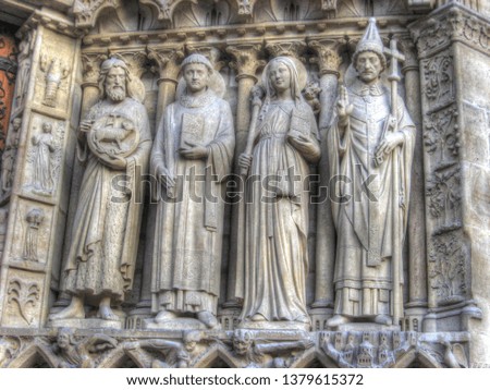 Some statues on the wall of Notre Dame Church in Paris, France.