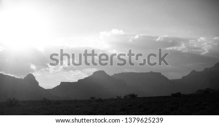 Sunset over the of the silhouette of the Grand Canyon  (black and white)
