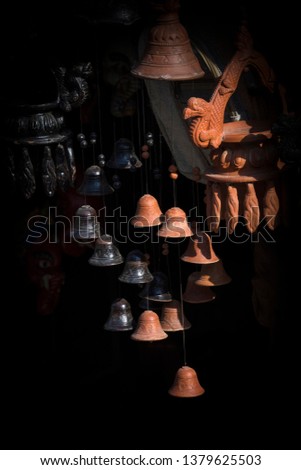 Beautiful small Clay hanging bells with Black background on street market Bandipur Nepal