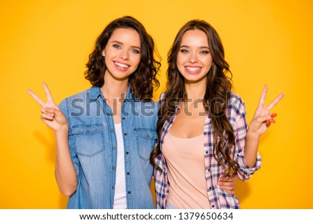 Portrait attractive hipsters millennial have free time weekends holidays wear plaid long hair modern outfit make v-signs isolated summer feel satisfied glad content excited laugh yellow background