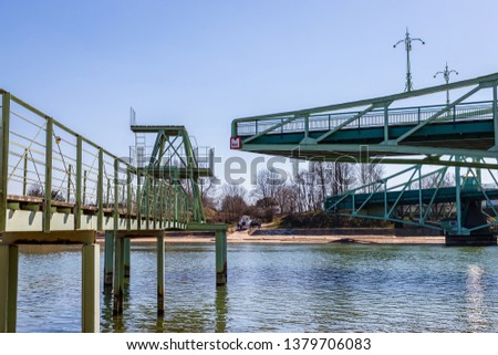old cutting iron bridge stands in port canal