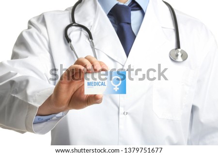 Gynecologist holding business card isolated on white, closeup. Medical service