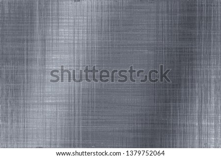 Brushed scratched metal texture. Polished stainless steel plate with light reflection.