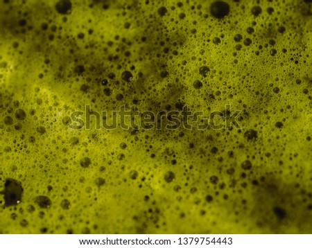Abstract green background with small bubbles.