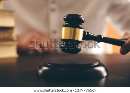 Close up lawyer businessman working or reading lawbook in office workplace.