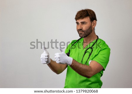 Photography of a veterinary doctor giving a thumbs up, facing forwards and looking at the horizon