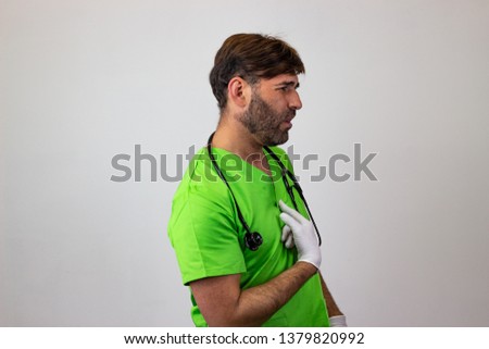 Photography of a veterinary doctor insulted, facing forwards and looking at the side