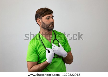 Photography of a veterinary doctor looking anguished or bitter, facing forwards and looking at the side