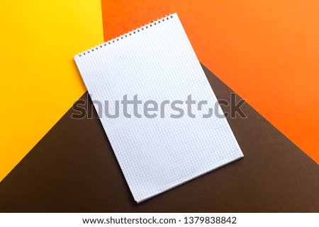 empty notebook isolated on colorful paper background