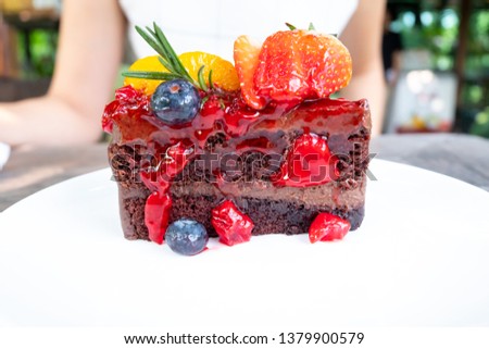 Strawberry Blueberry Raspberry and Orange Chocolate Cake, Mix fruit cake on the white plate