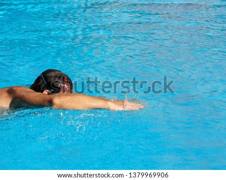  Man swimming in the  pool                              