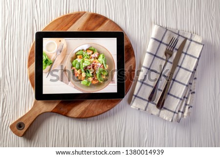 Food delivery concept with a digital tablet