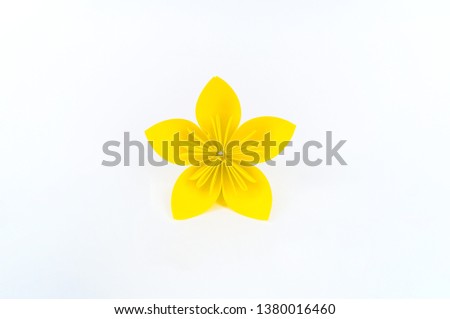 Origami kusudama yellow flower stands in a row against a white background. Rainbow color. Diy Paper craft handicraft. Isolate concept.