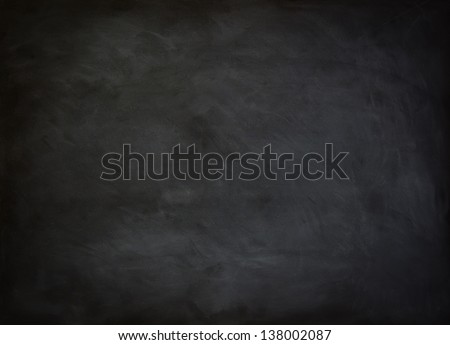 close up of a black dirty chalkboard Royalty-Free Stock Photo #138002087