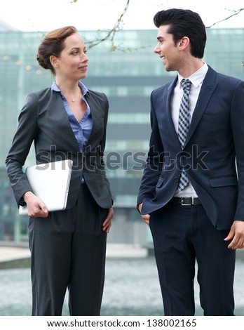 Portrait of business colleagues in discussion outdoors