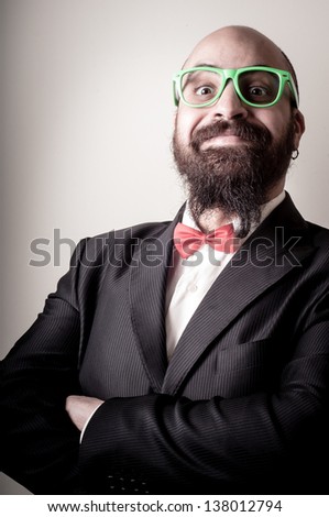  funny elegant bearded man on vignetting background