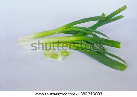 raw organic leek and leek slice isolated on white background