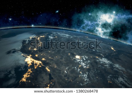 Picture of Earth in space, stars all around, night sky. Elements of this image furnished by NASA.