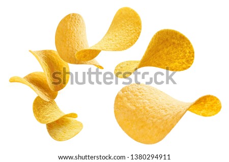 Flying potato chips, isolated on white background Royalty-Free Stock Photo #1380294911
