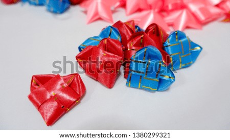 Ribbon decoration A variety of colors for different shapes, heart shape, fish, 
star, square shape The inside of the ribbon has hidden money or  coin. Is a tradition of merit making in Thailand.