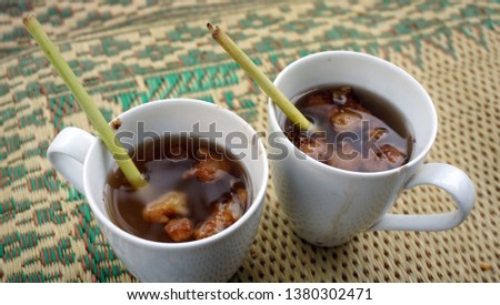 Wedang jahe is one of Indonesian traditional drinking that made from ginger, sometimes added by lemongrass. The picture was taken in Kopi Klothok coffee shop, Yogyakarta, Indonesia