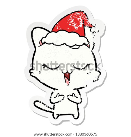 happy hand drawn distressed sticker cartoon of a cat wearing santa hat