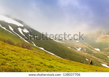 Photographer take pictures of spring landscape in the Carpathian mountains