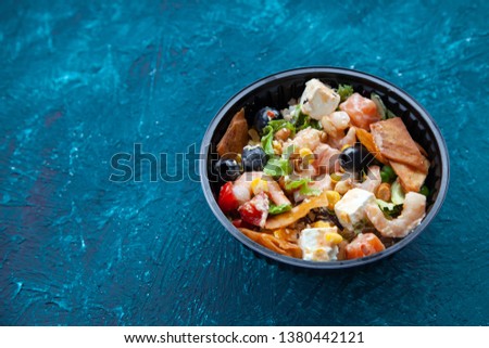 seafood platter, salmon and shrimp, olives, lettuce, tomatoes, corn, feta cheese. Copy space