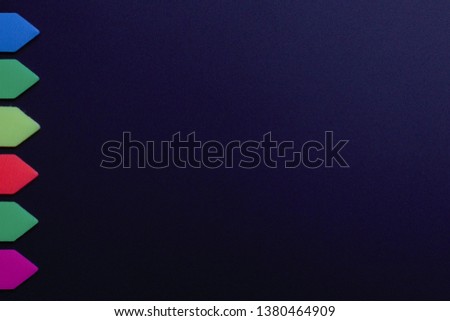 Construction paper with color tags, large signature space on a dark background