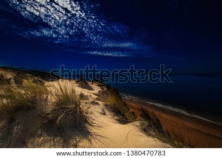 Beautiful dunes on the beach at night. Costa de la Luz, virgin beaches with cliffs and vegetation. The best beaches in Spain. Wonderful landscapes.