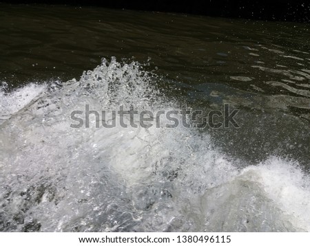 Waves splashing in the river. 
Water sports concept background.