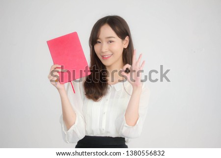 Portrait of thai adult working women white shirt show red book