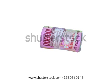 rolls of Indonesian money rupiah. Isolated on white background This photo was taken on April 25, 2019